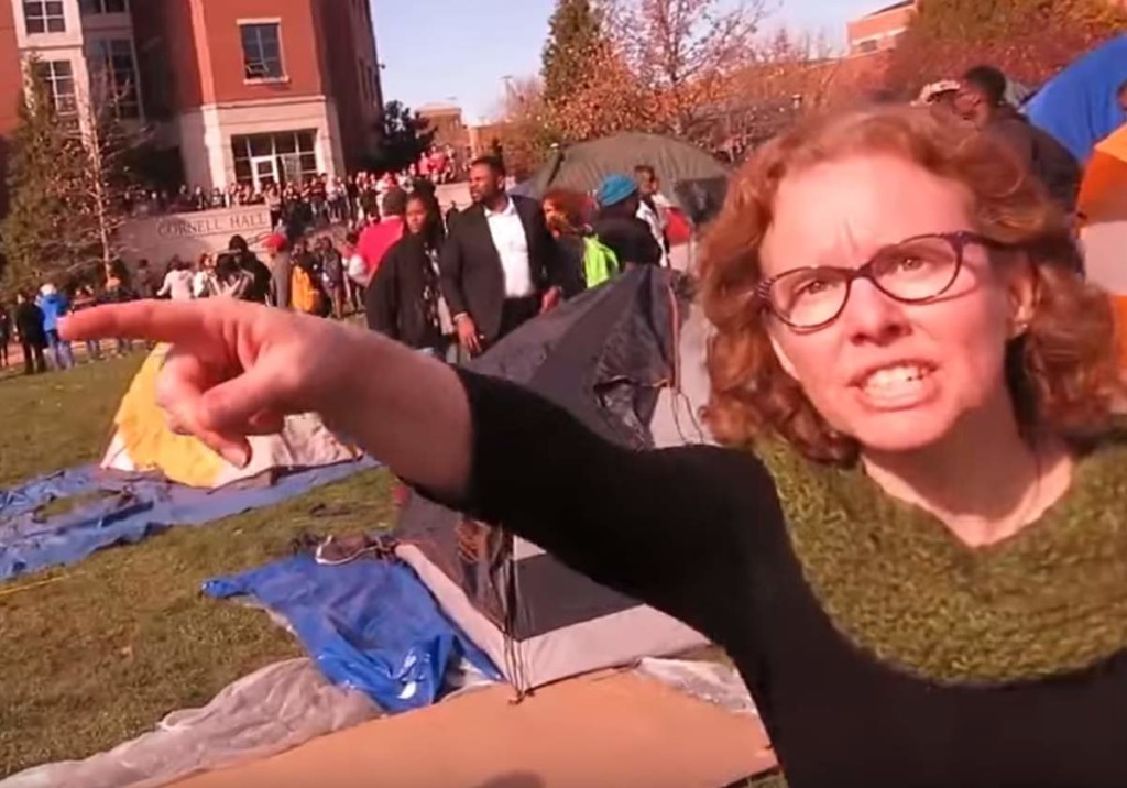 Professor Melissa Click shouting at student reporters to leave a public space.